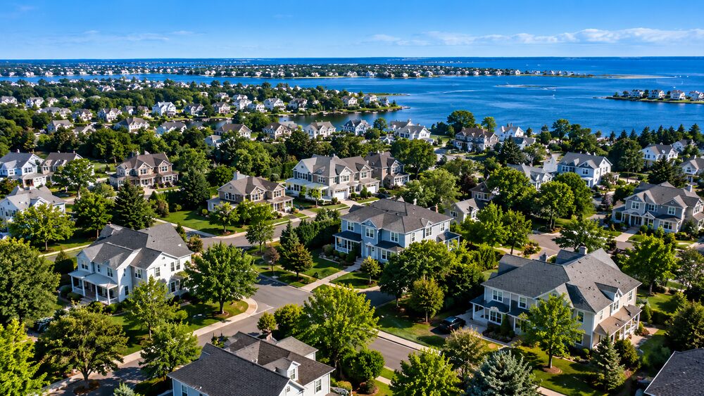 Aerial view of a coastal neighborhood beside open water
